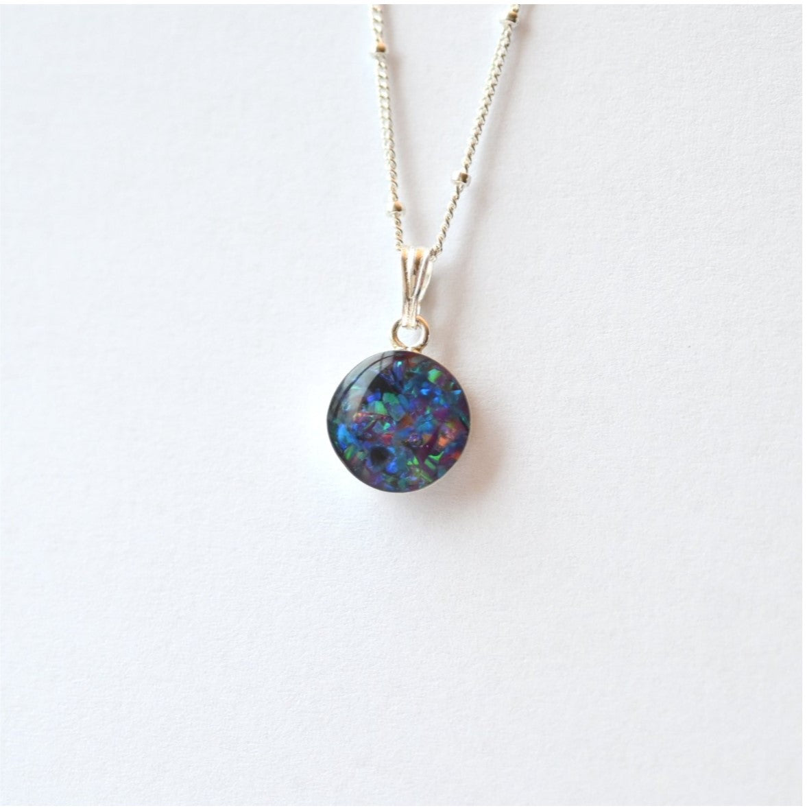 Elegant Sterling Silver Memorial Necklace with Circle Pendant – A beautiful 10mm or 12mm sterling silver pendant necklace with custom ashes, hair, or opal flakes inside, preserving memories.