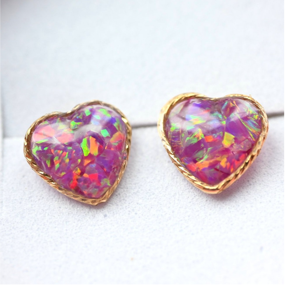 Close-up of 10mm gold-filled heart earrings with shimmering crushed opals, a beautiful UK-made keepsake to honour loved ones.