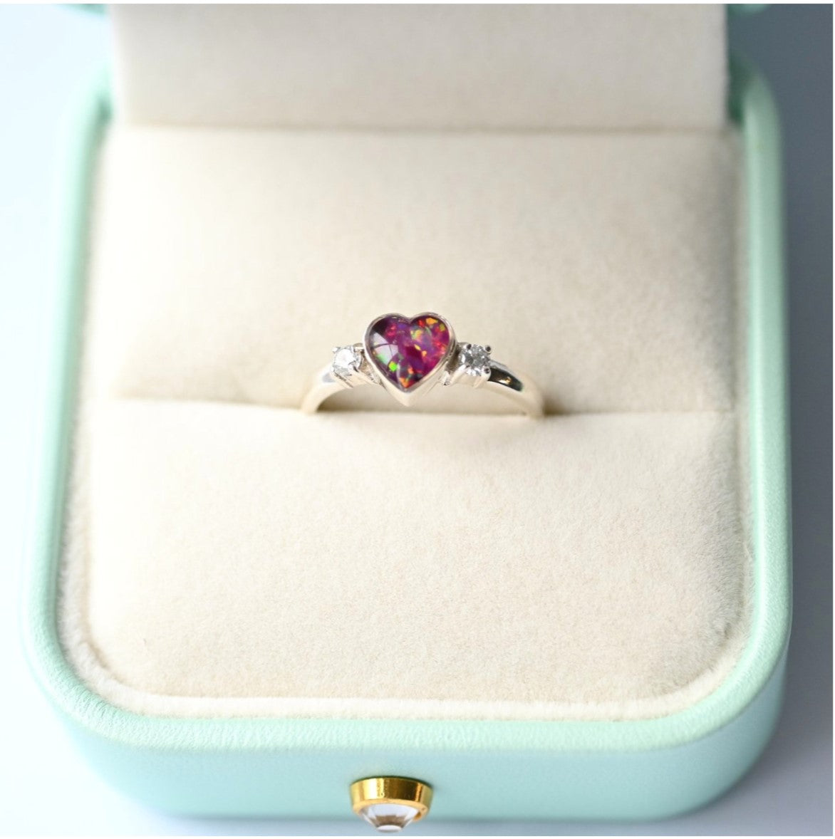 Elegant heart double gem ring with ashes, featuring a customisable design and sparkling gemstones, handcrafted in the UK as a meaningful memorial keepsake.