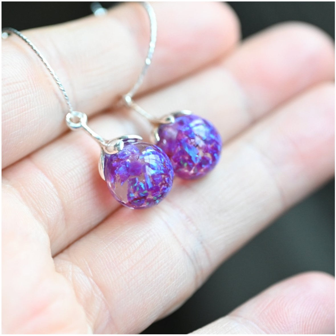 Sterling Silver Memorial Hoop Earrings with Ashes & Opal Flakes – A pair of handcrafted silver hoop earrings, designed with personalised stones containing ashes and shimmering opal flakes.