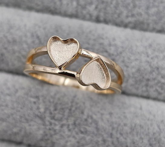 9ct gold double heart duo ring macro close-up on fingers showing both heart bezel details clearly