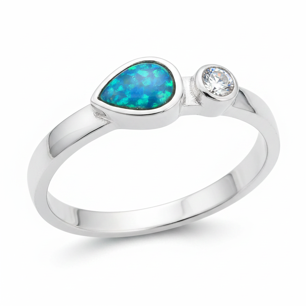 Teardrop single gem 925 silver ring with blue teal opal resin angled close-up view on white background
