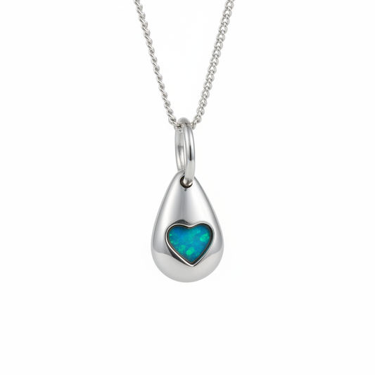 3D Pebble Solid Heart 925 Silver Memorial Pendant with blue teal opal resin in heart bezel — white background