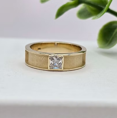 9ct yellow gold 6mm front face CZ ring, side angled view showing princess cut CZ stone flush in bezel on wide flat band