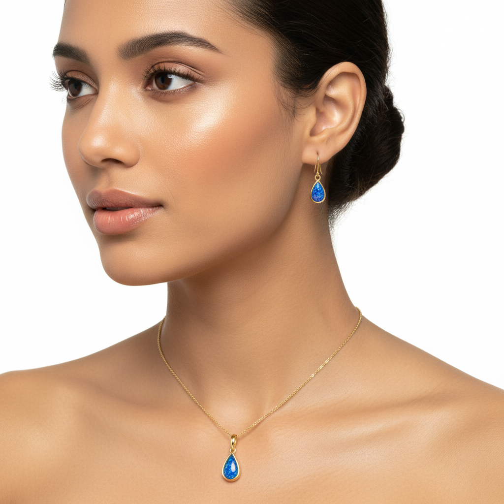 Model wearing complete 9ct gold teardrop memorial jewellery set – pendant necklace and matching drop earrings