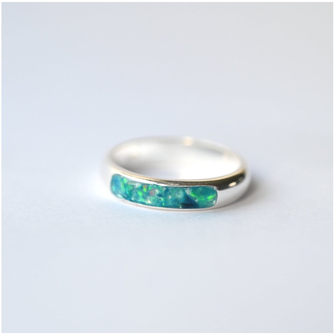 Customisable opal colours for the ladies silver channel ring with ashes, offering a personal touch for each customer