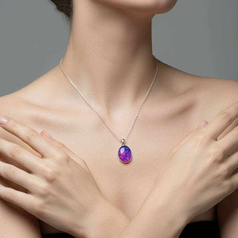 Back View of Memorial Opal Flake Oval Pendant on Sterling Silver Chain – A back view of the oval pendant, showcasing its smooth sterling silver setting and opal flakes inside.