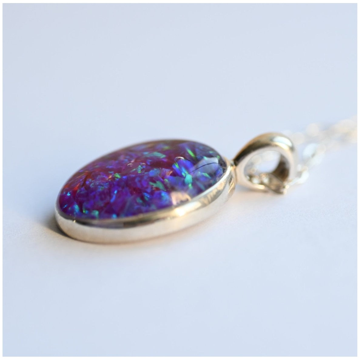 Close-up of Memorial Opal Flake Oval Pendant with Sterling Silver Chain – A detailed view of the opal flake oval pendant on a sterling silver chain, custom-made as a memorial keepsake.