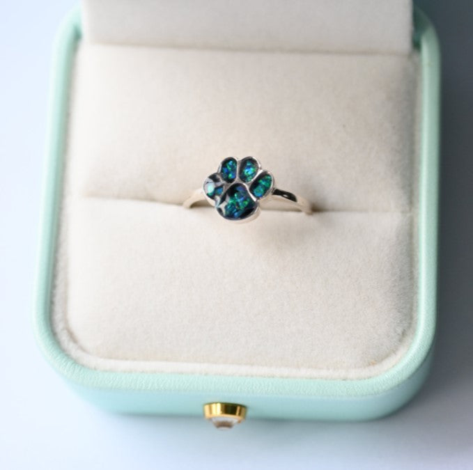 Close-up of an 8mm paw print memorial ring, available in sterling silver or 9K gold, beautifully crafted to honour your beloved pet.