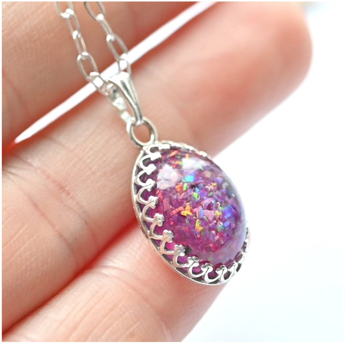 Hand Wearing Sterling Silver Necklace with 10x14mm Memorial Pendant – A model’s hand displaying the elegant sterling silver necklace with a personalised 10x14mm stone.