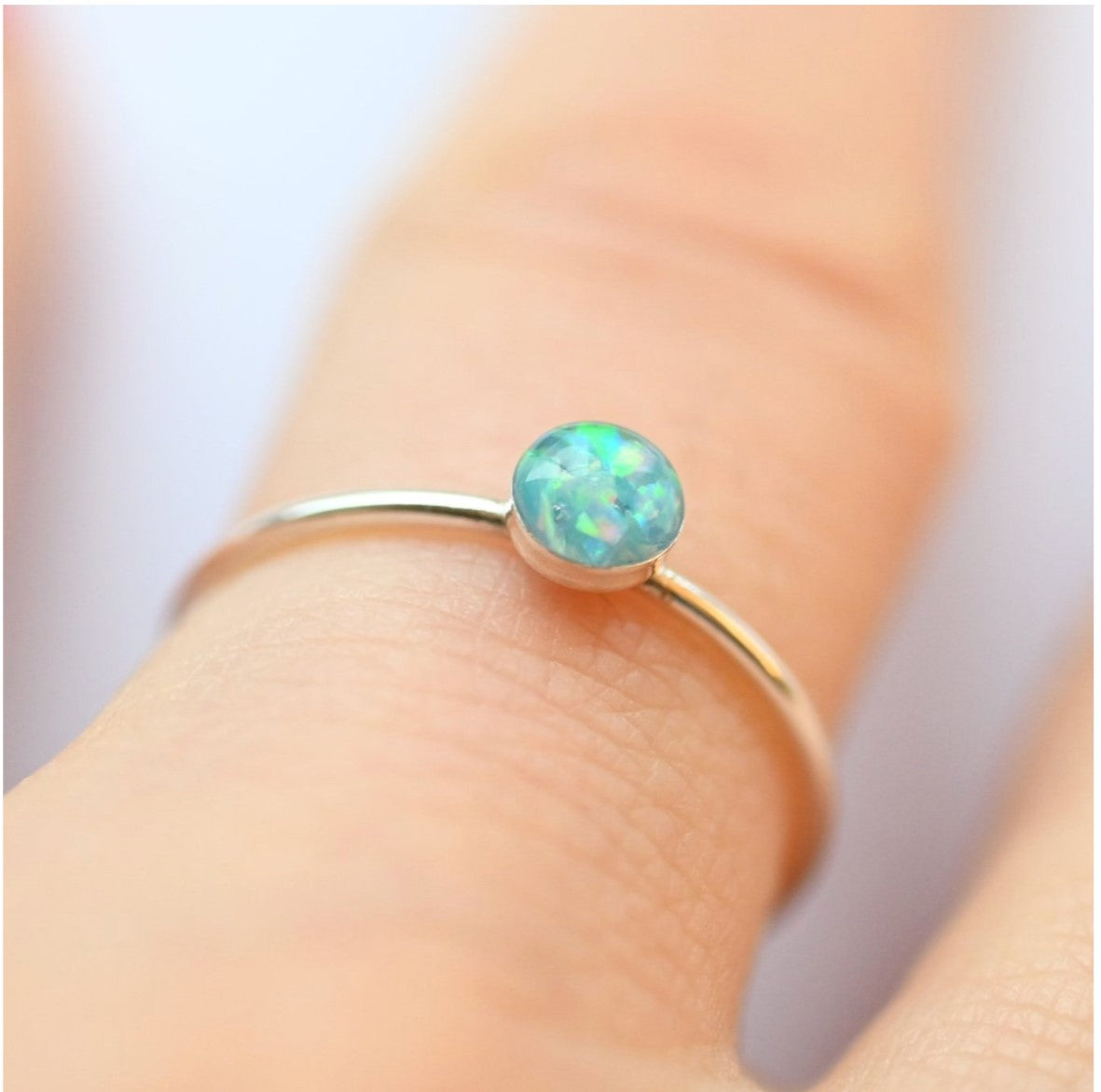 Side View of Sterling Silver Memorial Ring with 4mm Ashes Stone – A close-up side angle showcasing the slim silver band and memorial stone with opal shimmer.