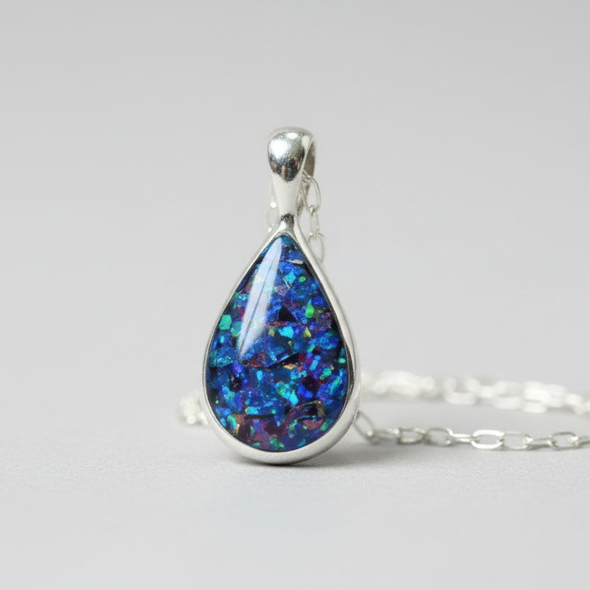 Close-up of Sterling Silver Memorial Ashes Teardrop Necklace – A delicate teardrop pendant with preserved ashes and shimmering opal flakes, set in sterling silver for a timeless keepsake.