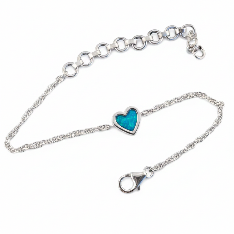 Flat lay — blue teal opal, white bg