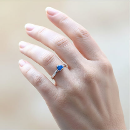 Side view of a handcrafted 6mm heart memorial ring, preserving ashes in a timeless design.