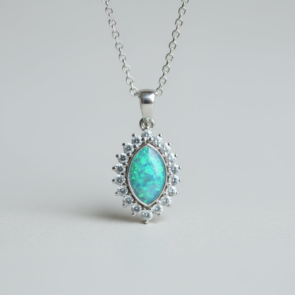 Silver necklace with a turquoise pendant on a light gray background