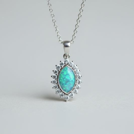 Silver necklace with a turquoise pendant on a light gray background