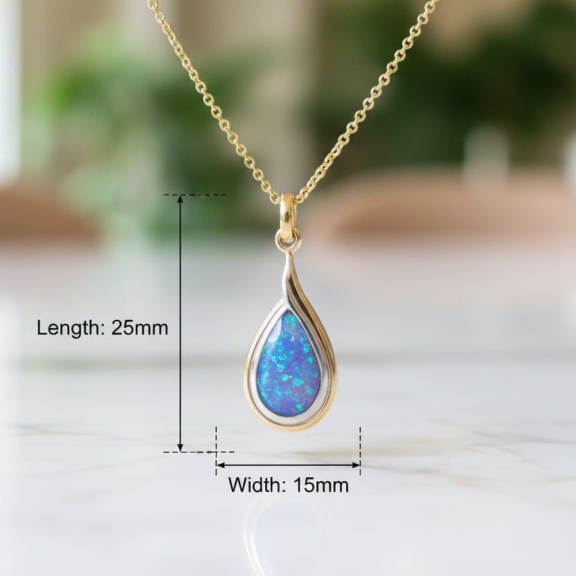 Necklace with a teardrop-shaped pendant on a pink shirt