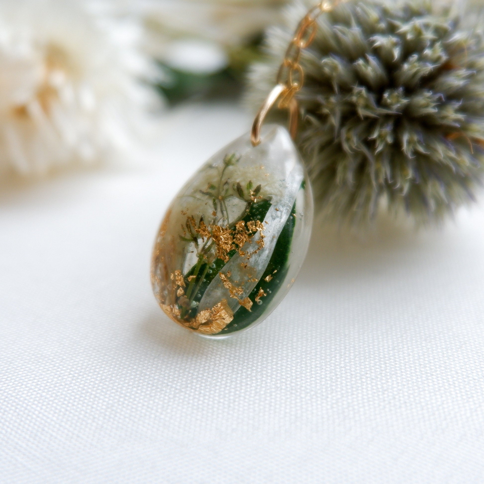 Teardrop flower keepsake necklace with gold flakes