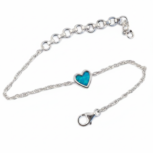 Flat lay — blue teal opal, white bg