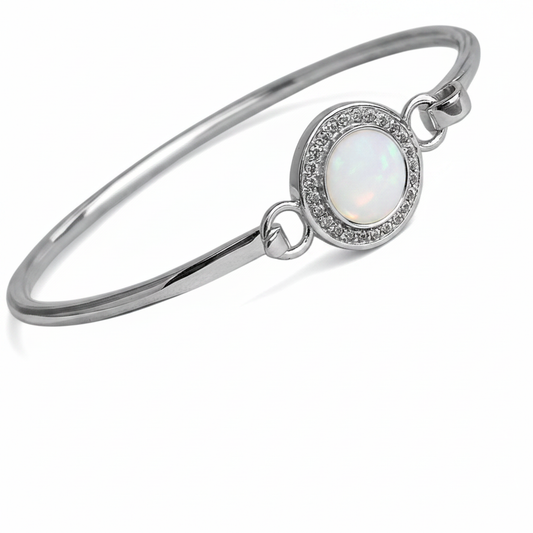 Halo CZ hook clasp silver bangle with white pearl opal resin in oval bezel, white background