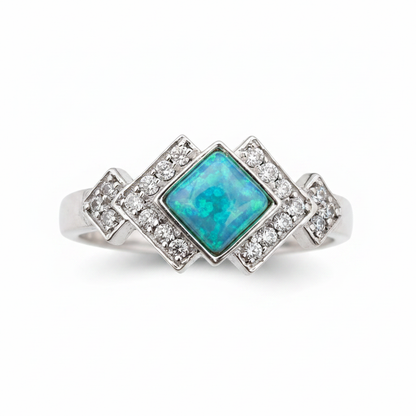 Art Deco CZ 925 silver ring with blue teal opal resin in diamond centre setting on white background