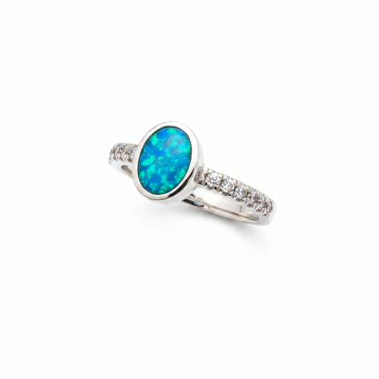 925 sterling silver oval multi CZ memorial ring with blue teal opal resin in oval bezel on white background