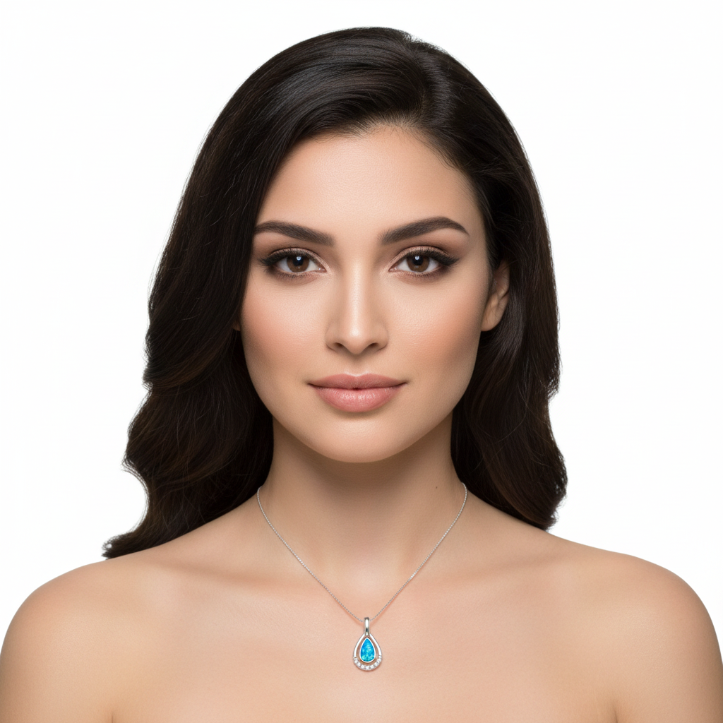 Model wearing silver 925 CZ teardrop memorial pendant at true 20x10mm scale