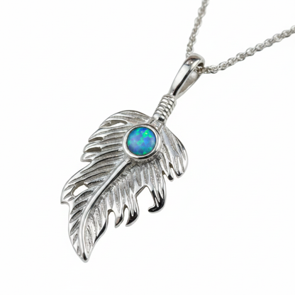 Silver 925 feather leaf memorial pendant with blue opal flakes, white background