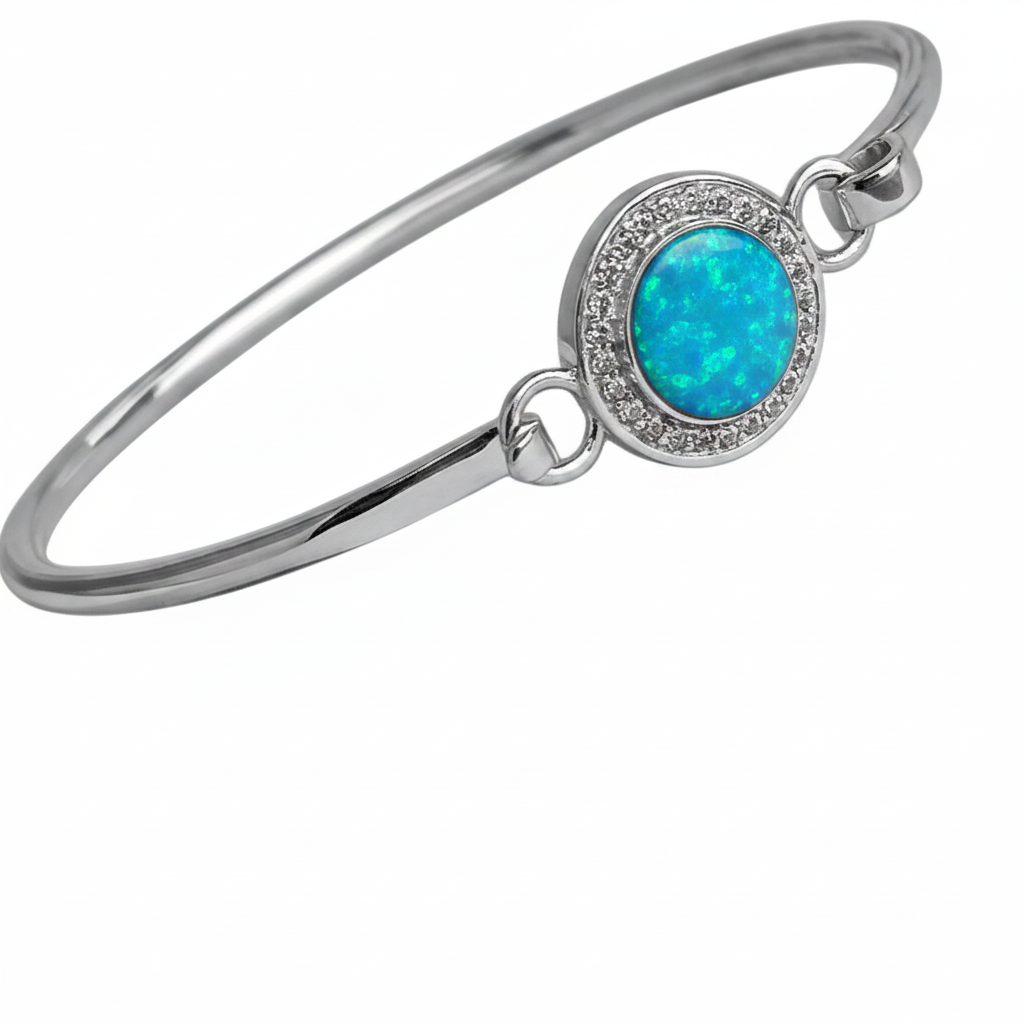 Halo CZ hook clasp silver bangle with blue teal opal resin in oval bezel, white background