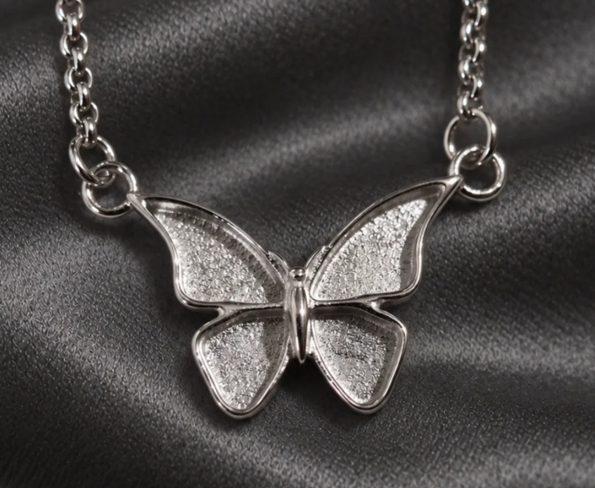 Butterfly memorial necklace in stainless steel with recessed wings