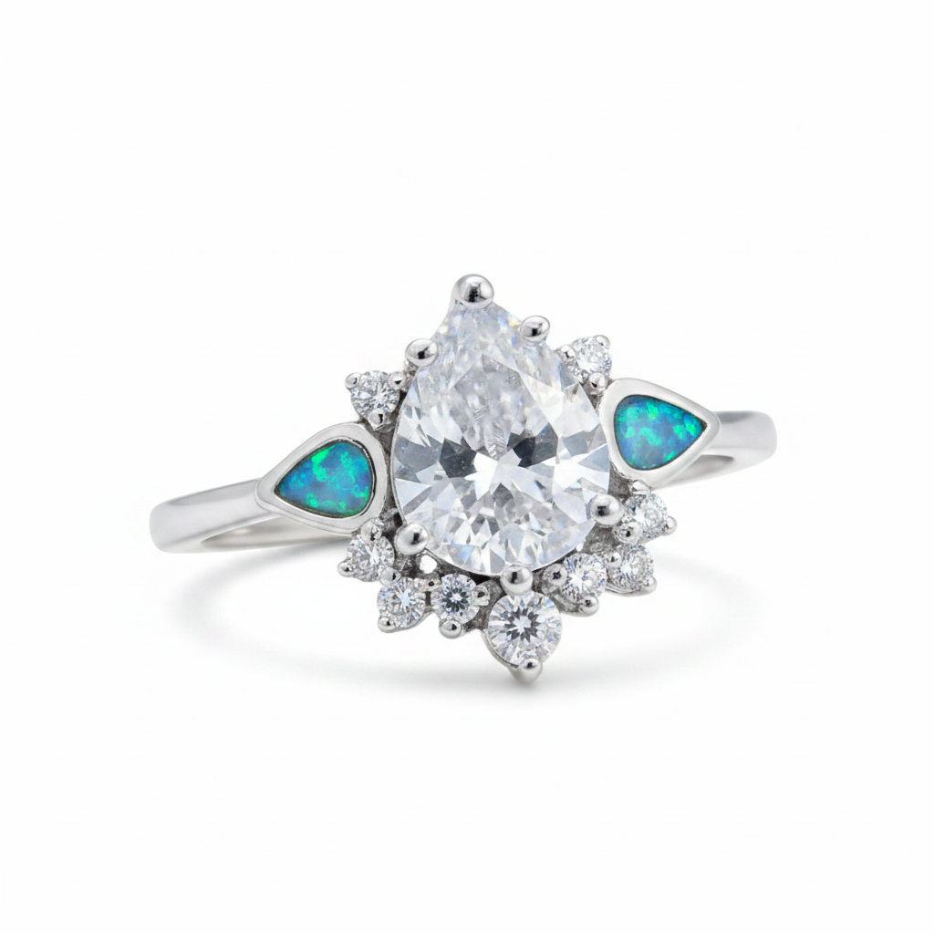 Silver 925 CZ dewdrop cluster ring with blue teal opal resin in tapered shoulder channels on white background
