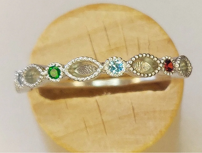 Argentium silver birthstone eternity band — top view showing alternating marquise milgrain settings and round birthstone gems in multiple colours