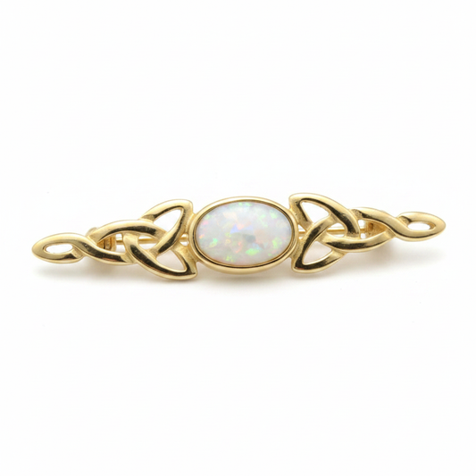 9ct gold Celtic trinity knot lapel brooch with white pearl opal resin in 7x5mm central setting on white background