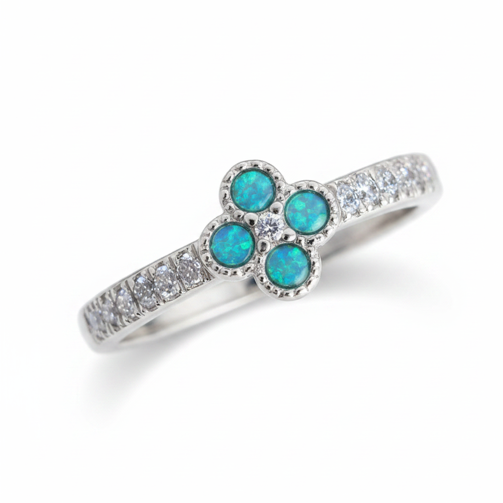 Petite clover 925 silver CZ ring with blue teal opal resin in four milgrain bezels on white background