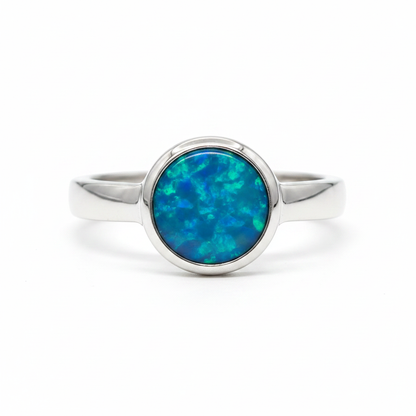 Thick Trim Round 925 Silver Ring with blue teal opal resin — bright polished silver, pure white background