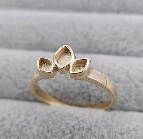 9ct yellow gold triple leaf marquise ring three-quarter view on grey velvet