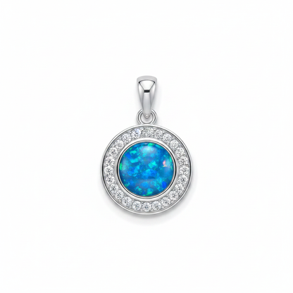 Solid silver 925 round halo CZ memorial pendant with blue opal flakes, white background
