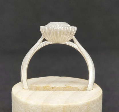 925 sterling silver marquise cut CZ halo memorial ring — side profile on wooden cone showing cathedral shank height and ribbed gallery detail
