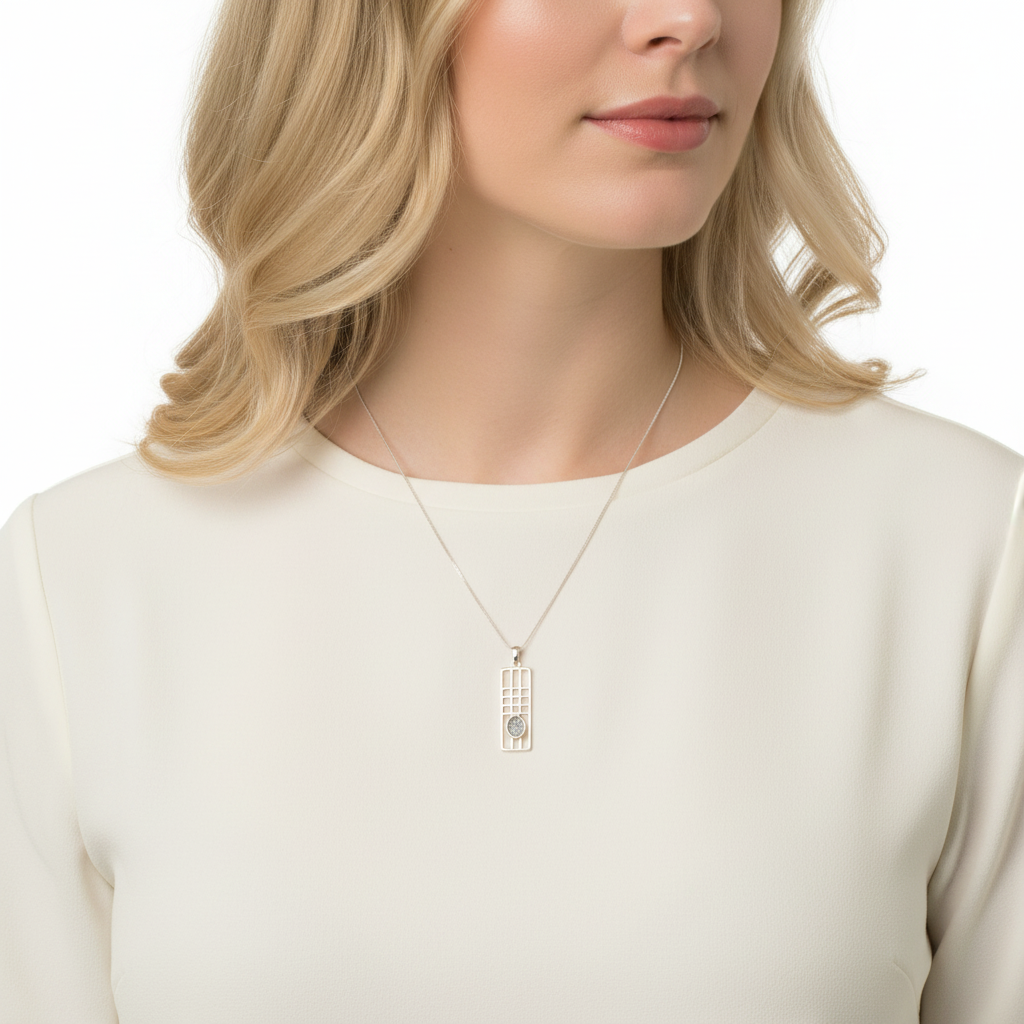 Model wearing silver 925 Mackintosh grid memorial pendant at true 32x12mm scale