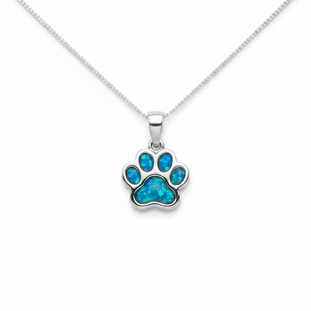 925 sterling silver petite paw memorial pendant necklace with blue teal opal resin in all paw pad bezels on white background