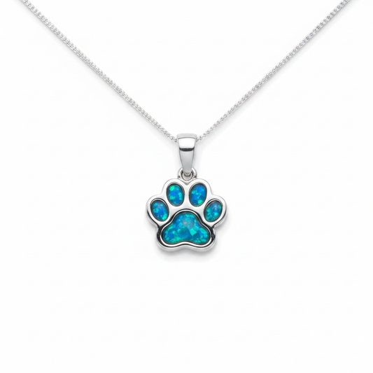 925 sterling silver petite paw memorial pendant necklace with blue teal opal resin in all paw pad bezels on white background