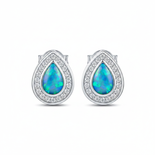 Silver 925 pear CZ halo stud earrings — blue teal opal resin, white background