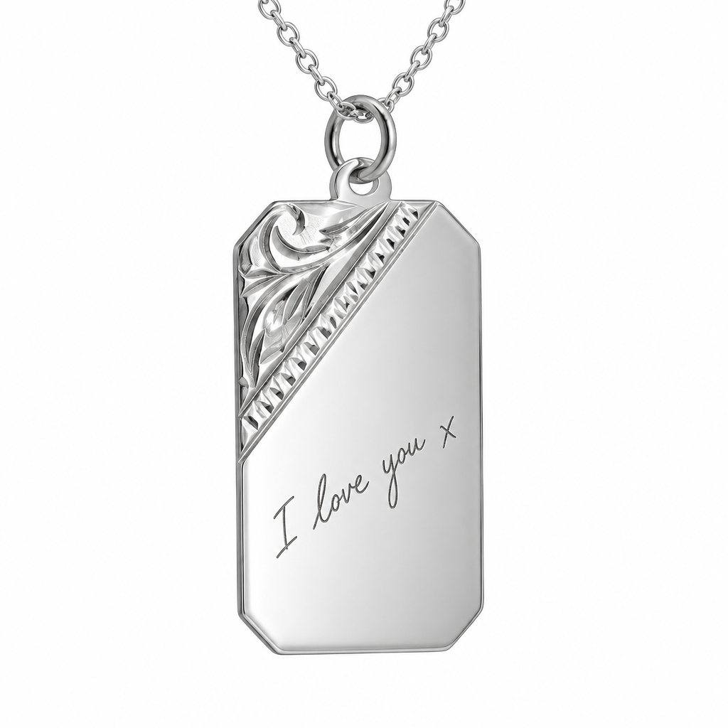 Illustrative handwriting engraving on floral-corner 925 Sterling Silver rectangular pendant on a silver chain against white
