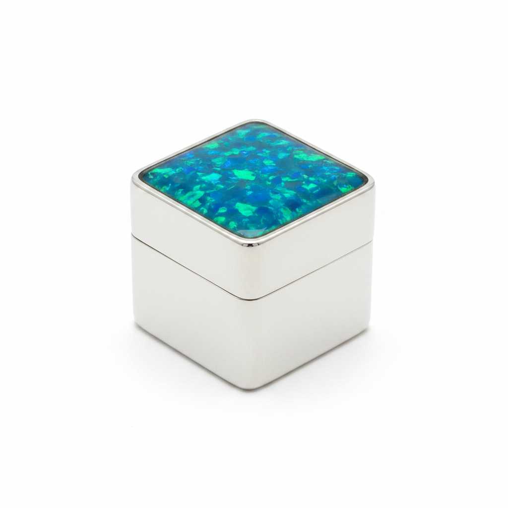 Silver 925 square pill box with blue teal opal resin in open bezel top on white background
