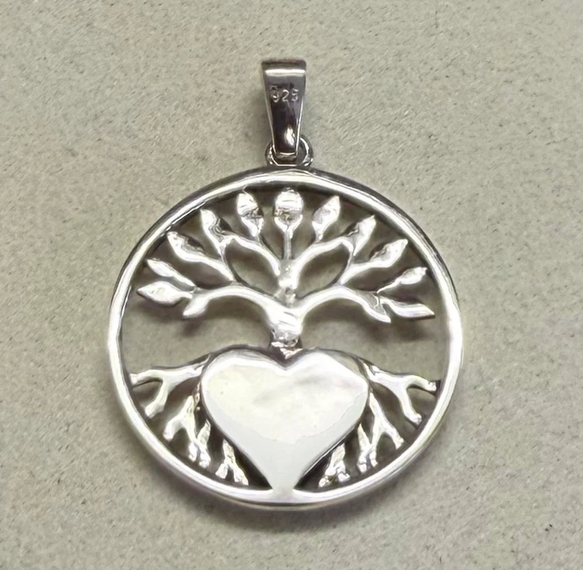 925 sterling silver tree of life pendant reverse side showing flat engravable back of heart bezel and 925 stamp on bail