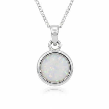 Thick Trim 12mm Round 925 Silver Memorial Pendant with white pearl opal resin — white background