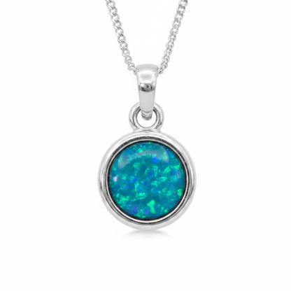 Thick Trim 12mm Round 925 Silver Memorial Pendant with blue teal opal resin — white background