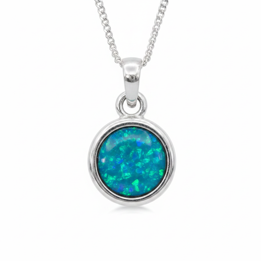 Thick Trim 12mm Round 925 Silver Memorial Pendant with blue teal opal resin — white background
