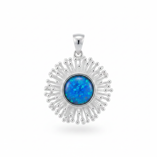 Silver 925 starburst memorial pendant with blue opal flakes, white background