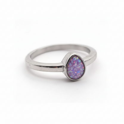 Stainless steel teardrop bezel memorial ring with lavender purple opal flakes resin inclusion on white background